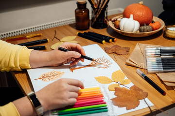 Art therapy for mental health recovery, Making Art Helps Improve Mental Health. Creativity and Recovery. Faceless portrait of woman drawing autumn trees with markers