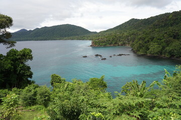 High angle view of coastline with island and hills