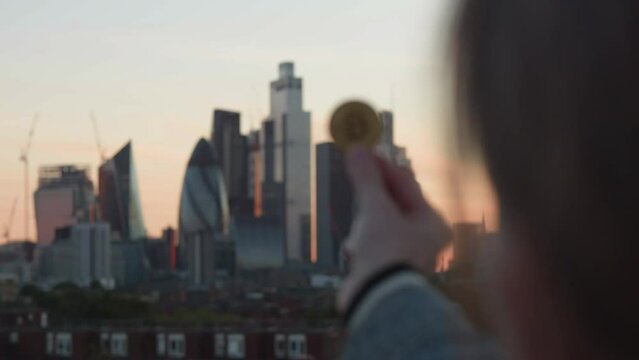 Bitcoin in London's financial district at Sunset