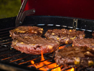 grilled meat hamburgers on the grill