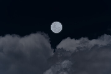 Naklejka na ściany i meble Full moon with clouds in the sky.