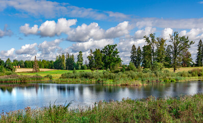 Clear forest lake with clear blue water near Sangaste Castle in the Estonian county of Valga on southern Estonia. Light ripples on the water.