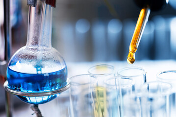 Test tube containing chemical liquid in laboratory, lab chemistry or science research and...