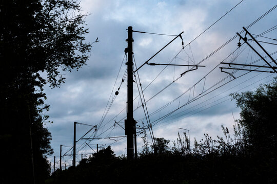 railroad power lines against blue sky