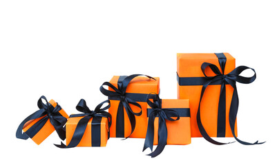 The Halloween gift box has an orange color with a black bow isolated on a transparent background.