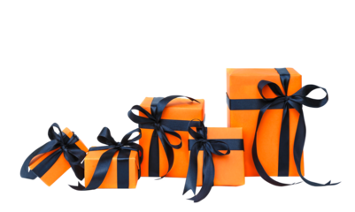 The Halloween gift box has an orange color with a black bow isolated on a transparent background.