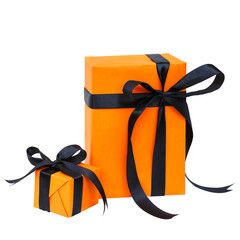 The Halloween gift box has an orange color with a black bow isolated on a transparent background.