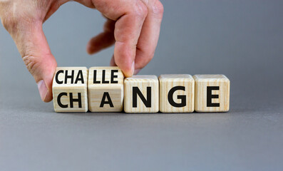 Challenge and change symbol. Concept words Challenge and Change on wooden cubes. Businessman hand. Beautiful grey table grey background. Business challenge and change concept. Copy space.