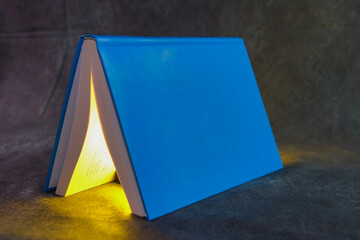 Close up view of open book. Selective focus. Ideal for education presentation. Drawing attention