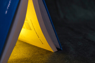 Close up view of open book. Selective focus. Ideal for education presentation. Drawing attention