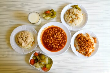 Table scene of assorted take out or delivery foods. Traditional Turkish cuisine. Various Turkish meal and appetizers. Top down view on a table.