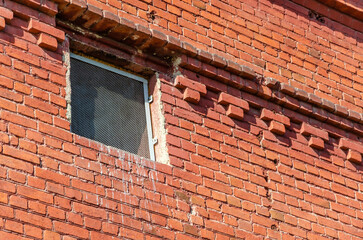 Fototapeta premium An old brick building with windows.