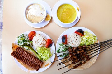 Table scene of assorted take out or delivery foods. Traditional Turkish cuisine. Various Turkish meal and appetizers. Top down view on a table.
