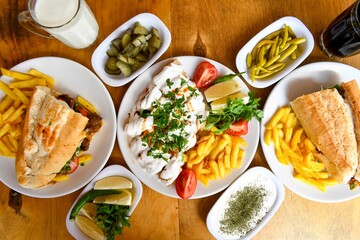 Table scene of assorted take out or delivery foods. Traditional Turkish cuisine. Various Turkish meal and appetizers. Top down view on a table.