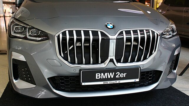 Front mask of modern subcompact executive car BMW 2er, possibly U06 in dark silver metallic colour, displayed on motorshow in Bratislava, Slovakia. 
