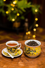 Darjeeling tea cup and traditional pot.