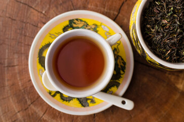 Darjeeling tea cup and traditional pot.