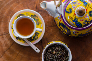 Darjeeling tea cup and traditional pot.