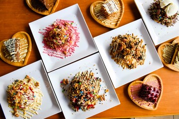 Delicious meat kebab with fresh vegetable salad served with variety of Turkish dishes and appetizers. Top view of assorted Turkish food and meze, tasty and healthy Mediterranean cuisine.