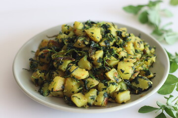 Aloo Methi. A sauteed potato side dish with fresh fragrant fenugreek leaves which is commonly known as methi leaves and spices