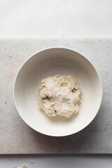 Fototapeta na wymiar Dry noodles dough, homemade noodles, process of making noodles, dough in white bowl