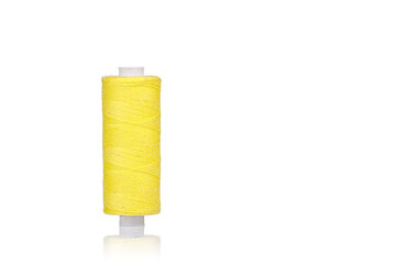 skein of thread yellow colors macro on a white background