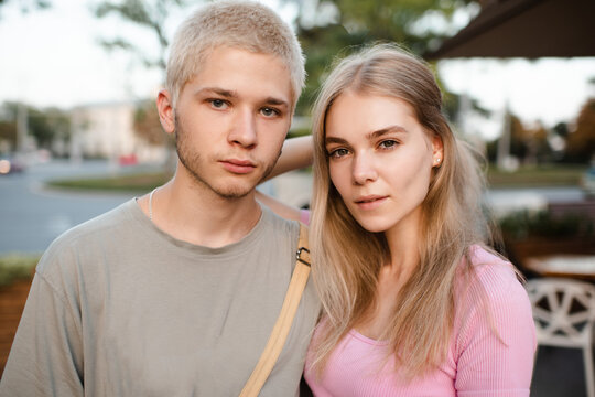 Romantic Love Couple Of Teenage Girl And Boy 17-18 Year Old Together Outdoor. Happy Teenagers Smiling.