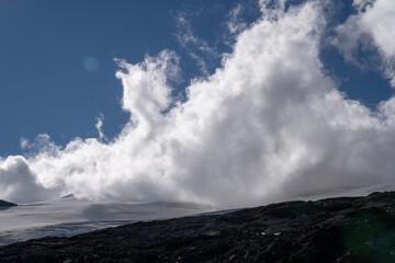 Obraz premium Glacier Castaño Overo and Tronador hill under a dramatic blue sky with beautiful clouds, in Patagonia Argentina.