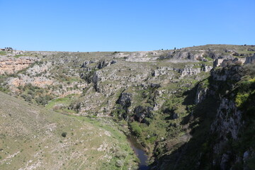 Fototapeta na wymiar View to the river in the gorge of Matera, Italy