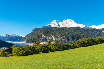 View to the Königssee covered with clouds and the Watzmann, the legendary central massif of the...