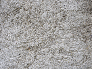 Old grey concrete wall with concrete texture for background. Front view with copy space.
