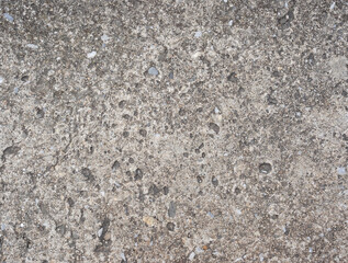 Old grey concrete wall with concrete texture for background. Front view with copy space.