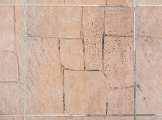 Stamped concrete pavement with irregular pattern background. Front view with copy space.