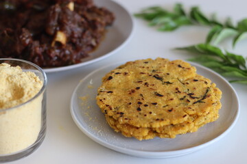 Makki ki roti or Maize roti served with mutton roast. An Indian flat unleavened bread made from corn meal flour served with mutton roast prepared in kerala style - obrazy, fototapety, plakaty