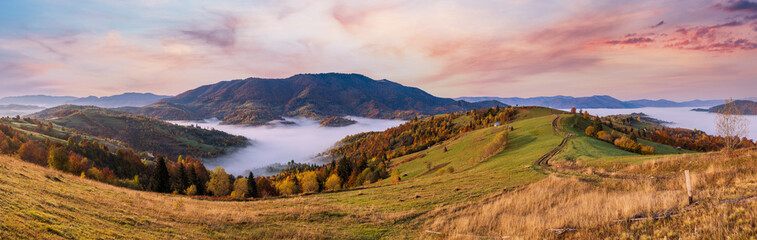 Morning foggy clouds in autumn mountain countryside.  Ukraine, Carpathian Mountains,...