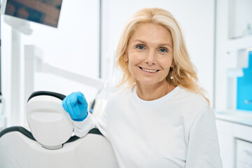Female person waiting for patient in dental cabinet