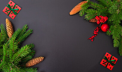 Christmas background of Christmas trees and gifts on a black background
