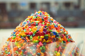 Huge pile of colorful jelly sweets on the candy shop window