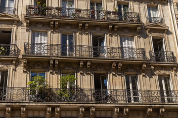 Fragment of the facade of a historic building in the center of Paris.
