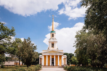 Church in the park in Ukraine among the crowns of trees. High quality photo