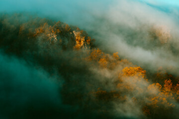 Foggy and misty fog rolls ff the Arkansa Ozark Mount during autumn weather. 
