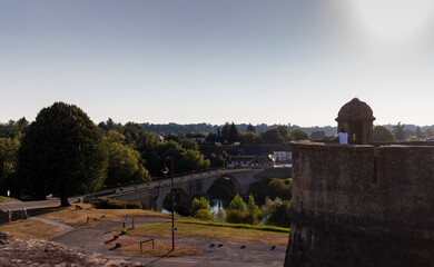 Obraz premium Ancient bridge over the river Gave d`Oloron at the town of Navarrenx, France.