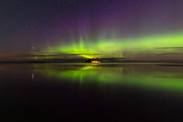 Northern lights and reflections in the water. Storsand, Jakobstad/Pietarsaari Finland