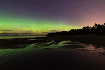 Northern lights and reflections in the water. Storsand, Jakobstad/Pietarsaari Finland