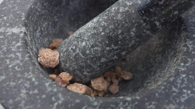 Cane sugar poured into a mortar