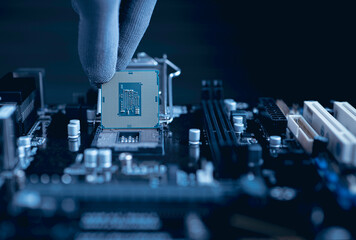 Engineer repairman computer uninstall CPU microprocessor to motherboard socket. the concept of...