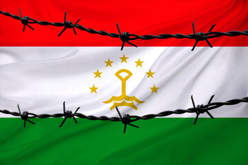 national flag of tajikistan on textured background, rows of barbed wire, concept of war,...