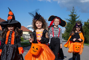 Kids trick or treat. Halloween fun for children.


