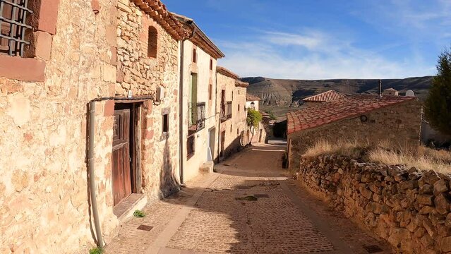 a street with traditional houses in Caracena village, Tierras del Burgo, province of Soria, Castile and Le&oacute;n, Spain