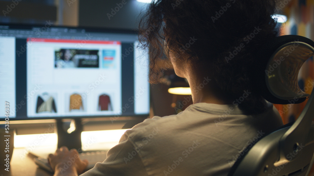 Poster Male web designer using personal computer for creating website in professional constructor while working on project remotely at home. Freelance